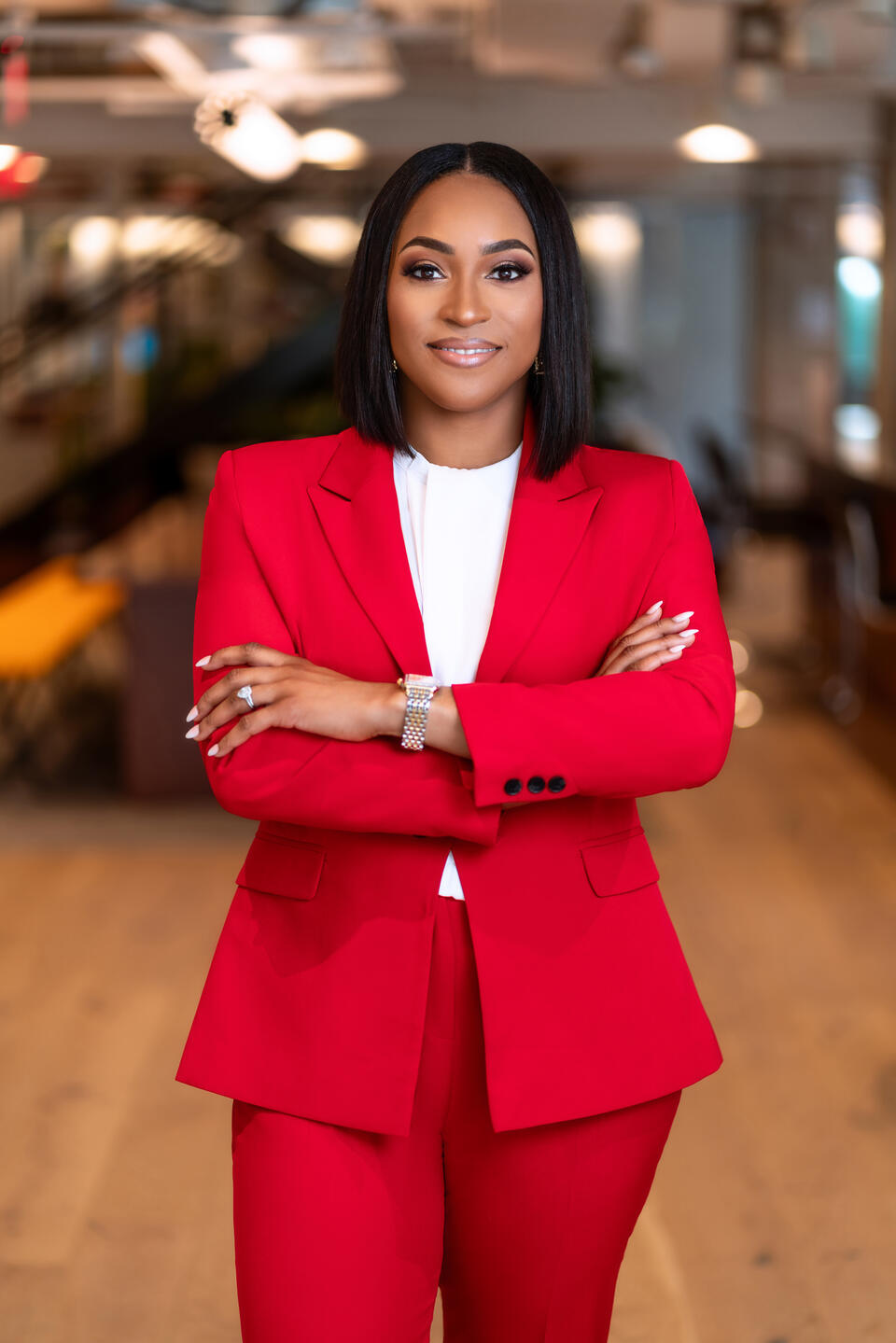 Corporate headshot - Woman in red blazer in office setting